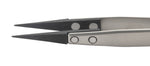 Close up of pointed carbon tweezer tips