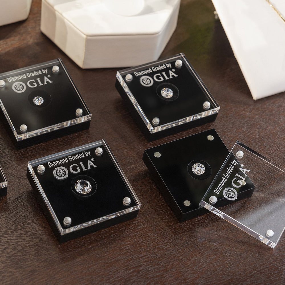 Group of four Loose Diamond Display Cases on counter