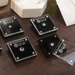 Group of four Loose Diamond Display Cases on counter